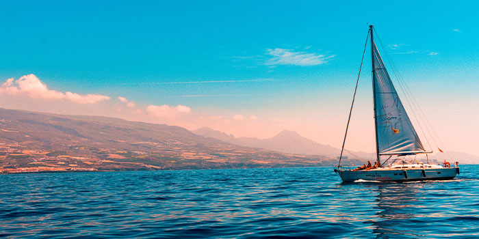 Sailboat on a lake representing Tour Marketing Suite crafting your success in travel tourism.