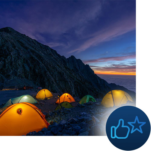 Tents camping in the sunset mountains with like and star icons representing Tour Marketing Suite finding your target audience on Facebook.
