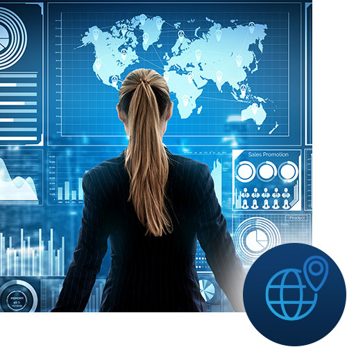Woman at a large screen with net and location icon representing Tour Marketing Suite in depth research to create your digital marketing strategy.