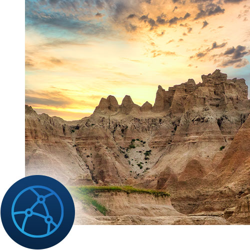 Sunset in the badlands, with network icon representing Tour Marketing Suite tracking digital marketing progress for your business.