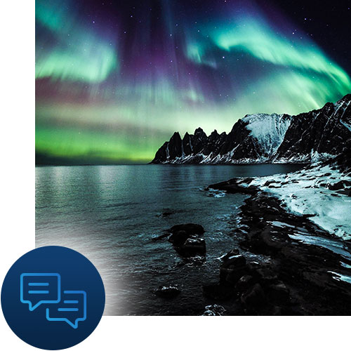 Northern lights over a rocky shoreline with messaging icon representing Tour Marketing Suite developing a marketing strategy for you.