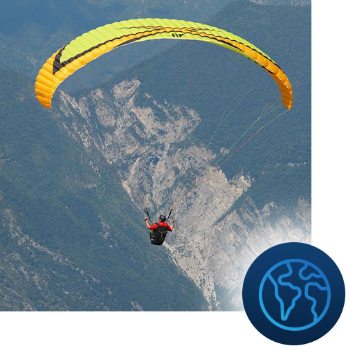 Person parasailing into the mountains with world icon representing Tour Marketing Suite and their SEO services helping you reach more people with less effort.